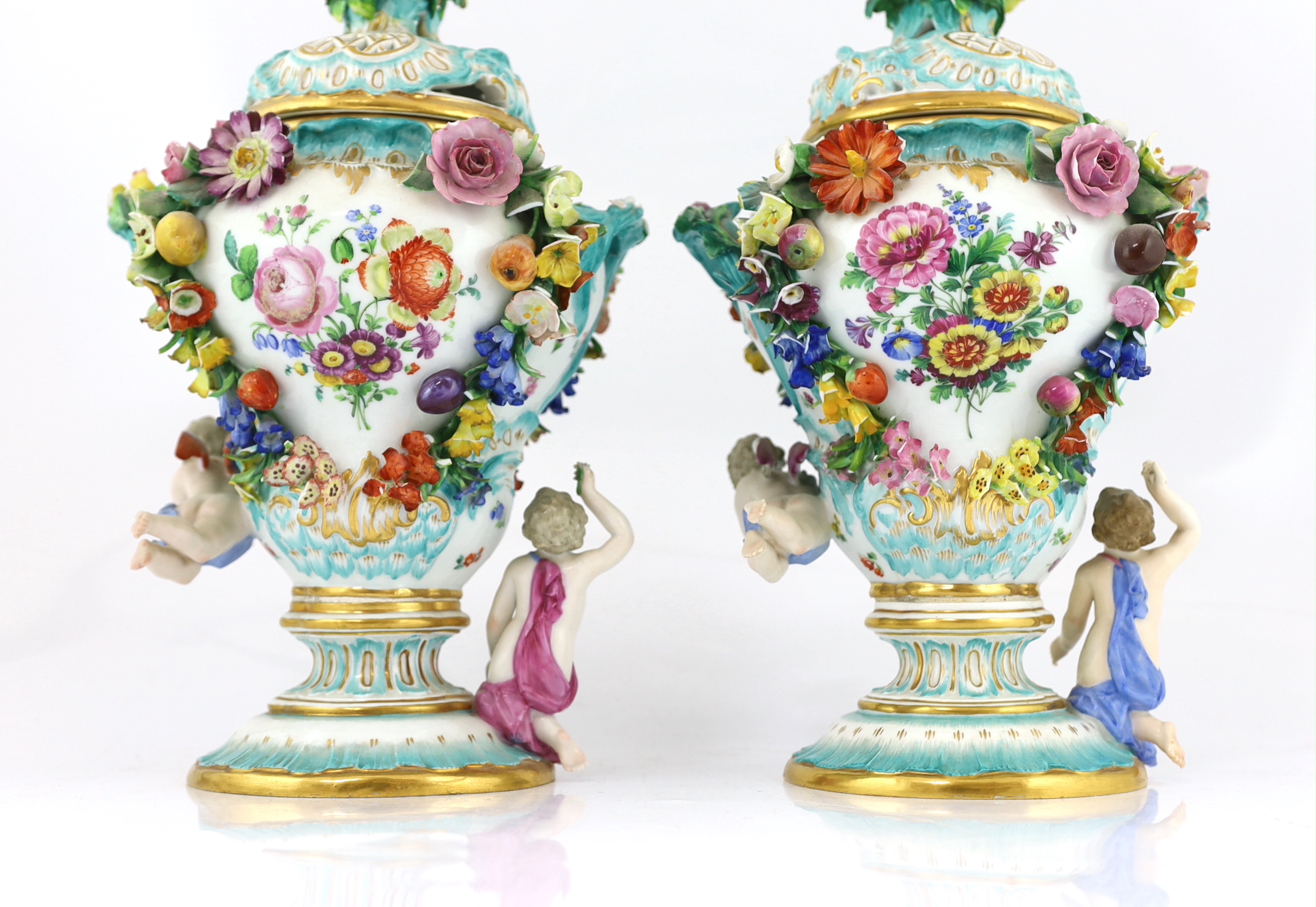 A pair of Meissen topographical flower encrusted vases and covers, 19th century, losses